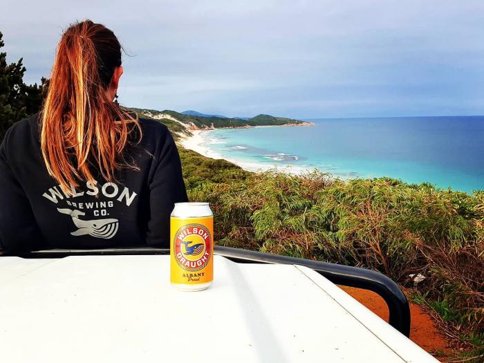 A local enjoying a Wilson Draught Session Ale at an Albany beach